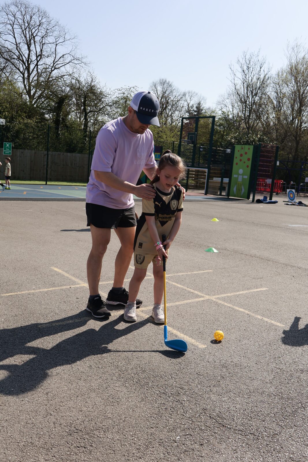 Coach supporting a child at Next Move Sport