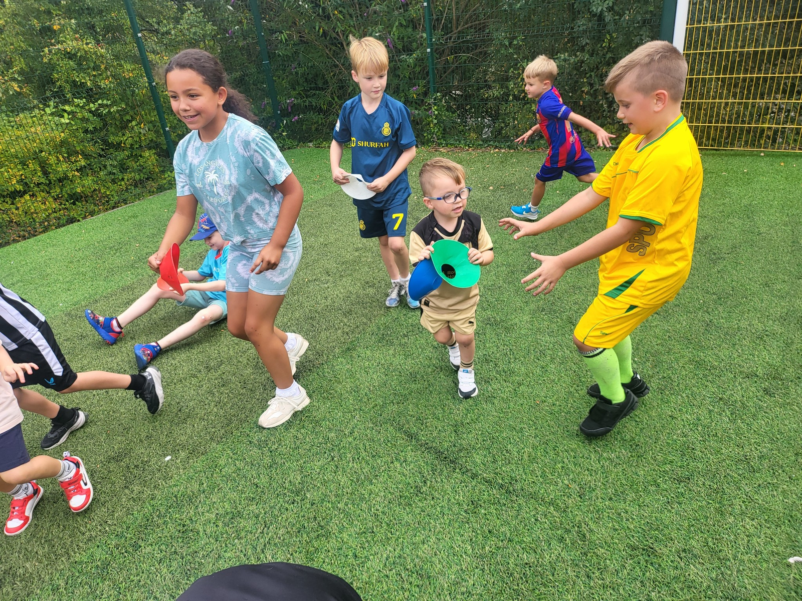 Children enjoying multi-sport activities at a Next Move Sport holiday camp in Rotherham